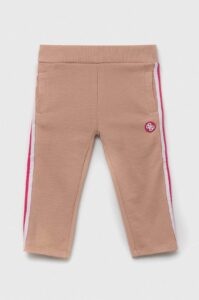 Dětské bavlněné kalhoty Guess růžová