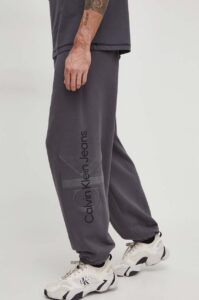 Bavlněné tepláky Calvin Klein Jeans šedá
