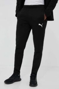 Tréninkové kalhoty Puma EVOSTRIPE černá barva
